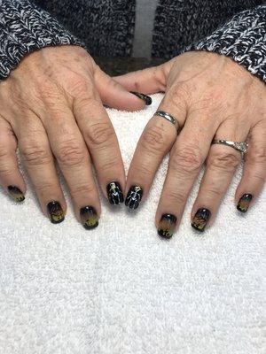 Get your nails designed for Halloween.