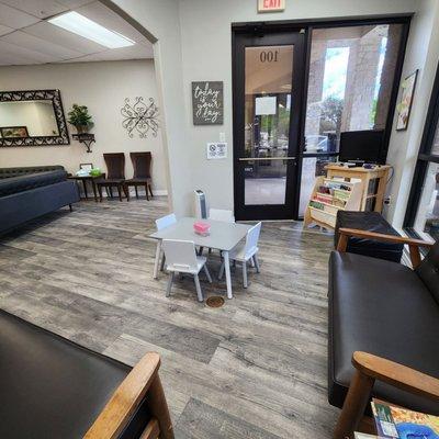 The waiting area is bright, clean, and comfortable.