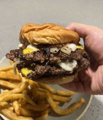 Triple cheeseburger w/ American & Swiss- Mayo, Ketchup, Grilled Onions.