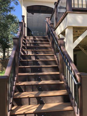 The stairs of the deck with lights.