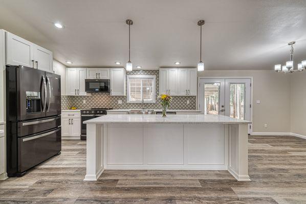 Extreme kitchen makeover. Kitchen was reconfigured and designed by our interior designer.Custom island was built by us to give it elegance.