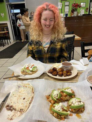 The full spread. Beleada, Tostones, Plátanos, Sope, Frijoles.