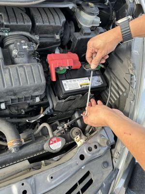 My husband installing the battery