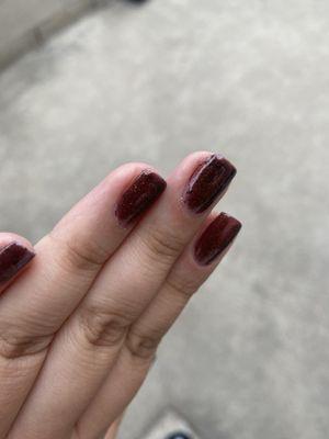 Blotchy job on the side of the nails.