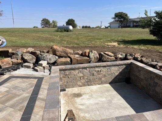 Dug hole way too deep for spa, then had to pour concrete to appropriate height. They used decorative retaining wall on the inside - covered