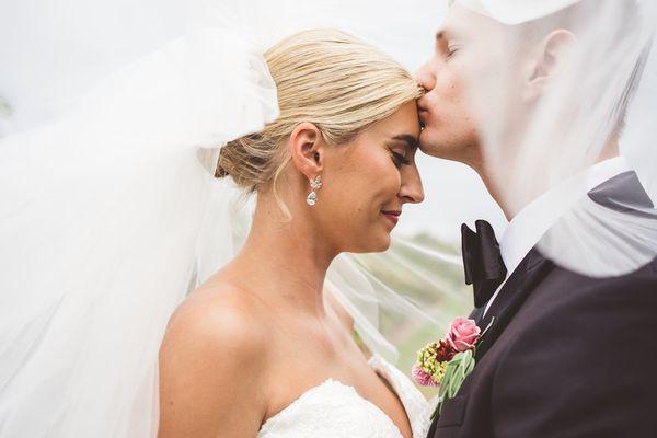 Wedding couple under a veil