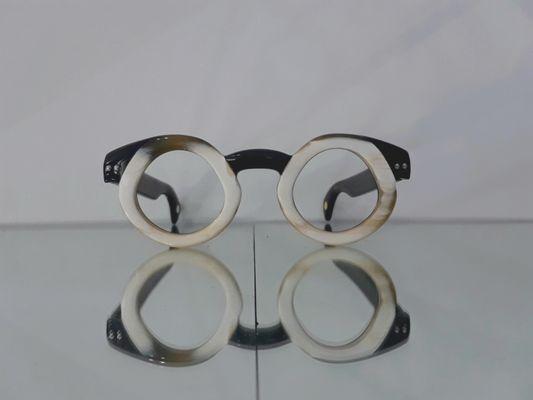 hand craved buffalo horn frames; exclusive New York designer.