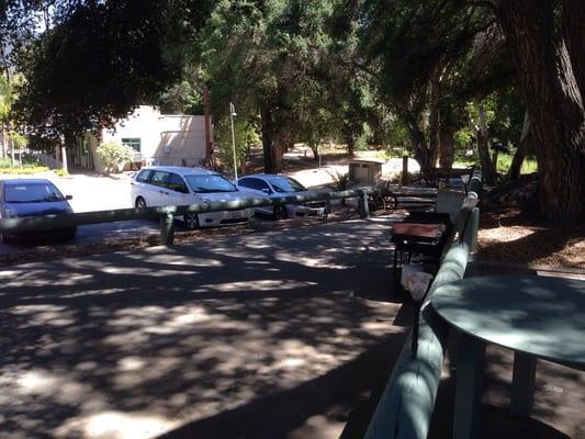 Large parking area and play ground, basketball court.