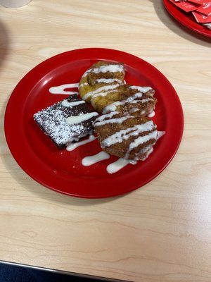 Cinnamon rolls with icing in the fudge brownie