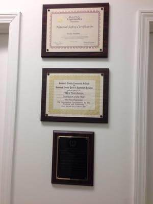 Owner's achievements posted on the wall.