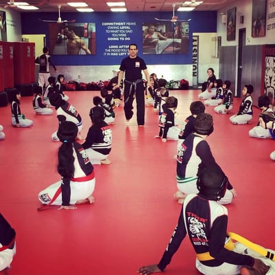 Sensei teaching the kids focus and discipline