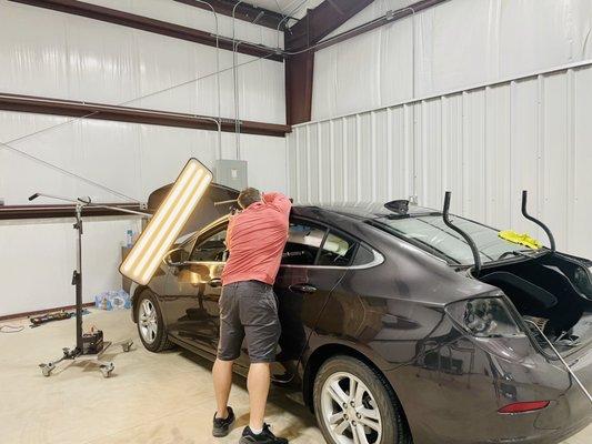 Total car hail damage repair! If you have anything on your vehicle damaged by hail we fix it! Windshields, lights, paint work, etc.