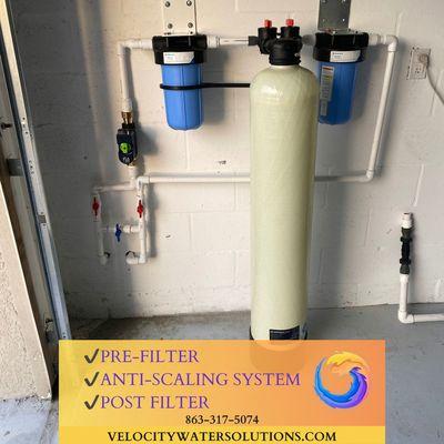 Garage Installation of pre-filter, salt free scale prevention system, and post-filter.