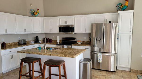 Cabinets and island painted white.