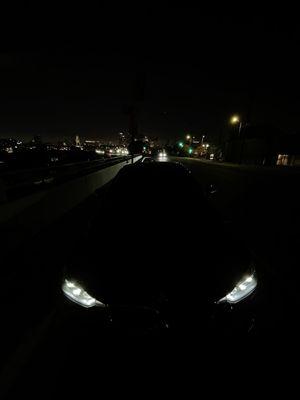 Blacked out bmw w/ lights on