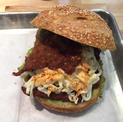 I'm ready for my closeup Mr. L.  Cemita Milanesa on a sesame roll with tomatillo-avocado, and chipotle salsas, and shredded Mexican cheese.