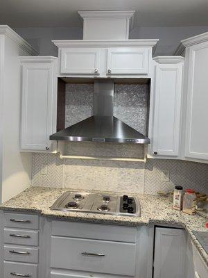 Modify cabinet for range hood and extend backsplash