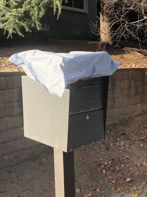 Package left out on top of mail box, not at door as instructed by shipper.