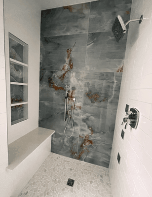 Shower from a design consult with body sprays and an ADA grab bar with a handheld attachment!