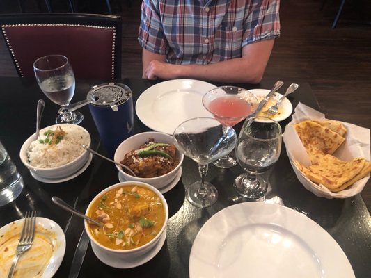 Our artfully-presented entrees -- Amchuri Murgh (chicken in a flavorful mango gravy) and Eral Varuval (shrimp in a spicy, drier paste).