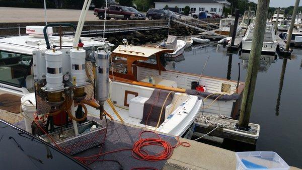 Another boat polishing with a closer shot of our pumping system.