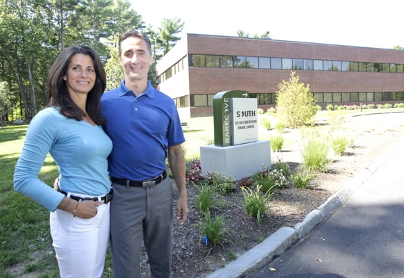 The doctors proudly displaying the front of our office building