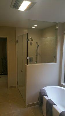 Frameless shower enclosures