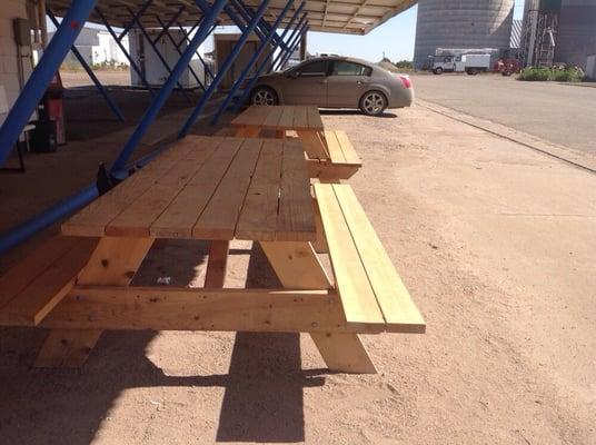 Picnic tables to sit at while you wait for the food, or on which to eat.