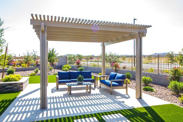 An amazing pergola to create shade for the family. Hardscape, plants and artificial grass