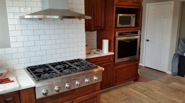 Completely remodeled kitchen with a custom gas range and hood and heated floors in bonus room that's attached.