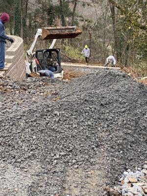 All concrete driveways, retaining walls and excavation.