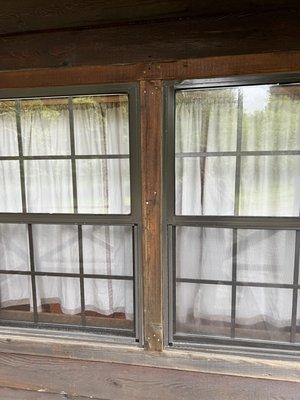 old curtain in window which didn't block light