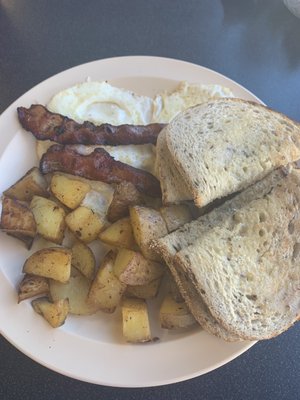 2 eggs, bacon, potatoes, and toast.