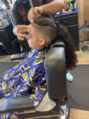 Barber: Chris giving my son the razor sharp treatment