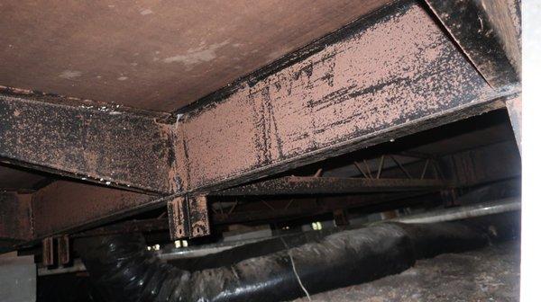 Inspecting the crawlspace of a mobile home