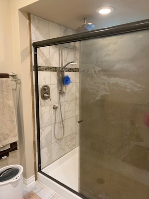 Shower with handheld shower bar and rain head shower