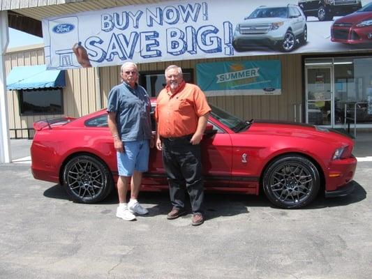 Charles R taking delivery of his Shelby Mustang from Hart Tollett