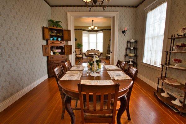 The main dining room and sitting area in background.