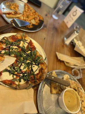 Caprese pizza, guiness beer cheese dip and frank red hot pizza.