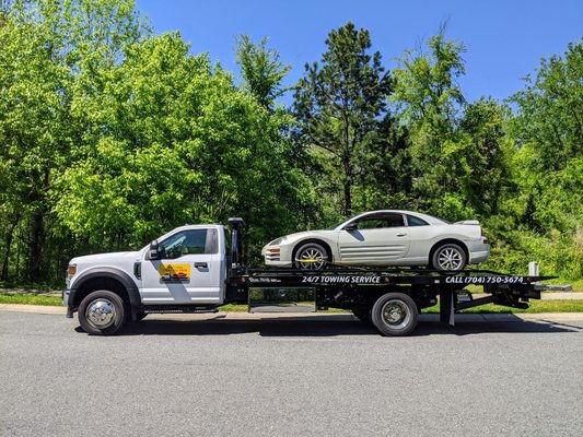 Mitsubishi Eclipse being towed by Snoork Towing in Indian Trail.