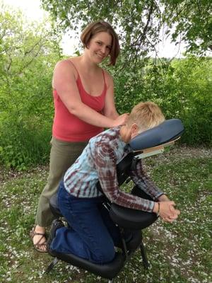 Ashley Hetrick, LMT giving Free Chair Massage at Willow Moon open farm day in 2013.