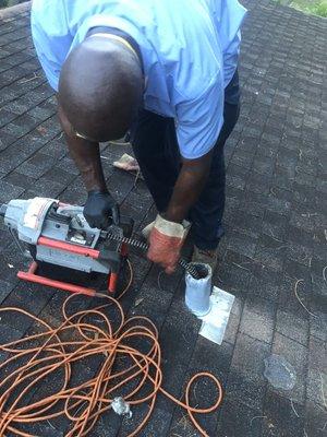 Cabling the kitchen drain through the roof vent