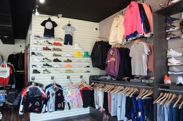 A zoomed in look at our children's shoes and jackets, and our women's jackets, sweat pants, and leggings.