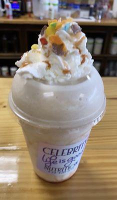 Banana caramel shake with whipped cream and fruity pebbles topping