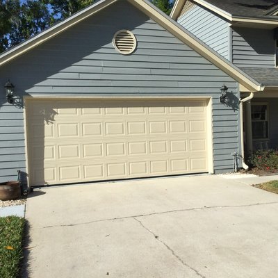 The garage door was sprayed w/2 coats of the same quality door paint as the front door to make it another highlight