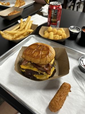 I had the smash burger. The cheese sticks are a must! Fries and tots were perfect crispiness.