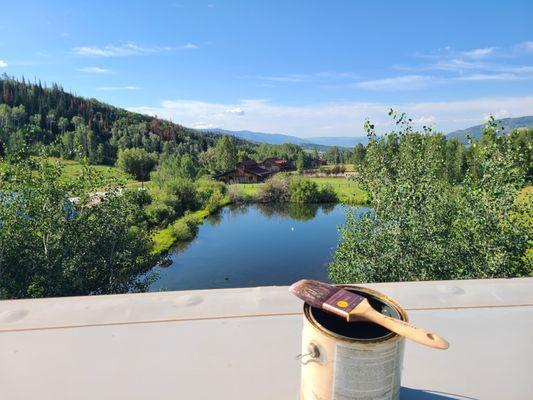 Another beautiful day in the mountains. Got to climb onto a 3rd story roof to stain the exposed ceiling beams of this customers house.