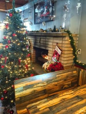 Roaring fireplace in the dining area. All decked out for the holidays.