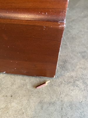 Scratches, dents and chunks missing from furniture.