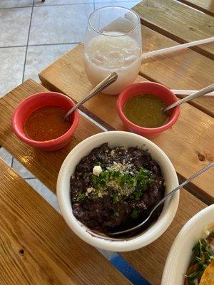 Refried black beans, salsa, and horchata; everything is delicious